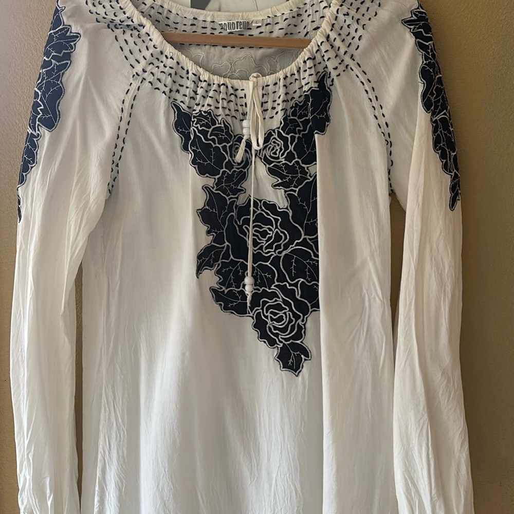Polyesterr crepe material. Beautiful detail. Black appliqué with black top